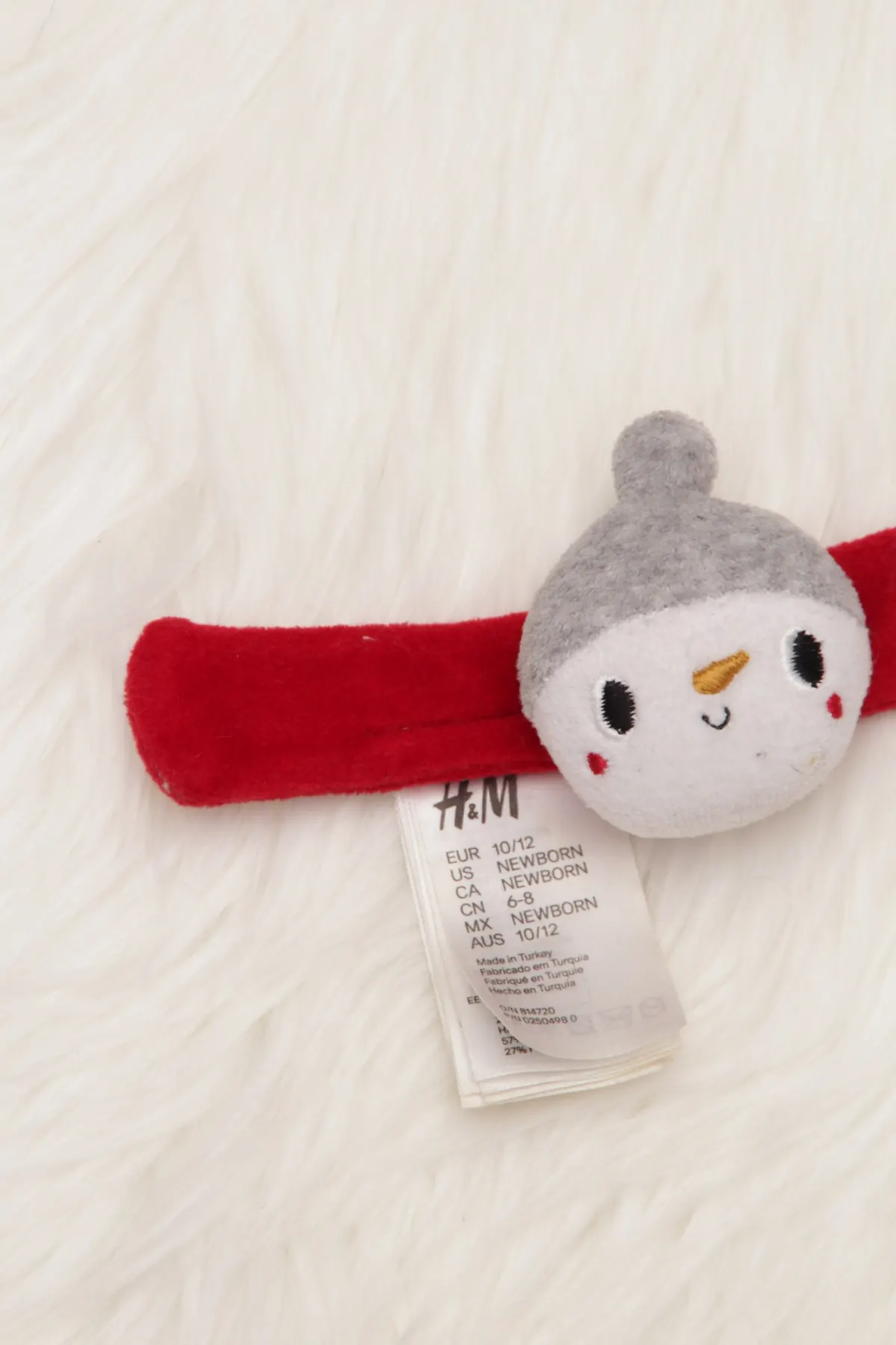 Arm - Rassel H&M Schneemann