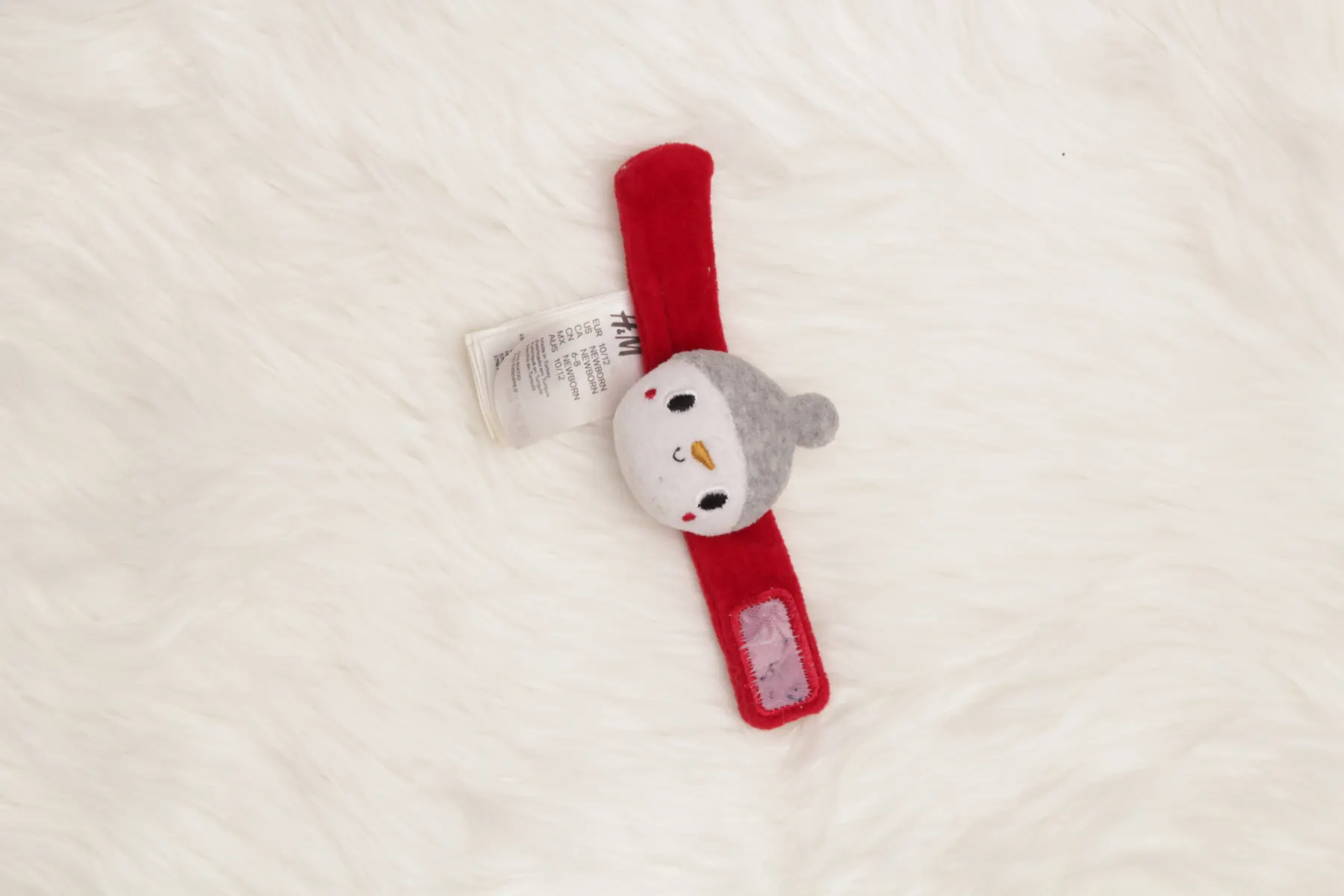 Arm - Rassel H&M Schneemann